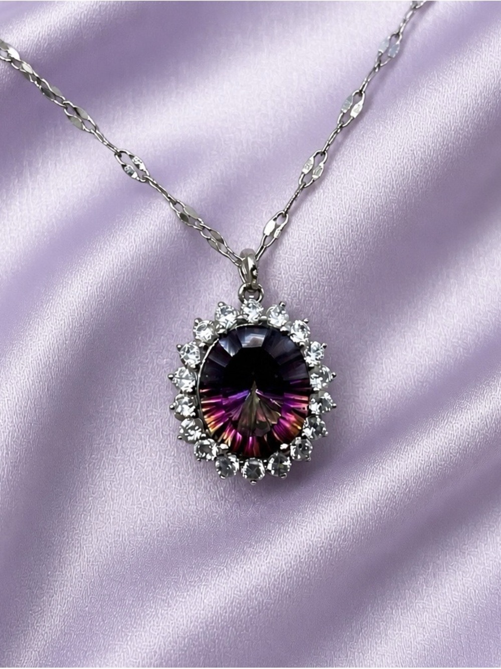 Mystic Topaz Concave-Cut Pendant. White topaz halo. Rhodium over S925. 18” Chain